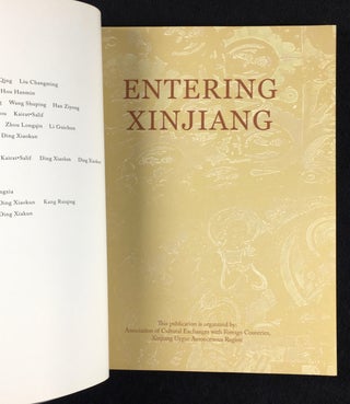 Entering Xinjiang. Book, with DVD at back. The vast land with varieties of land forms; a brief history; the traces of ancient human civilisation; the picturesque landscape; the ethnic customs; modern Xinjiang.